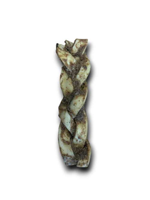 Braided rawhide dog chew treat with visible seasoning against black background