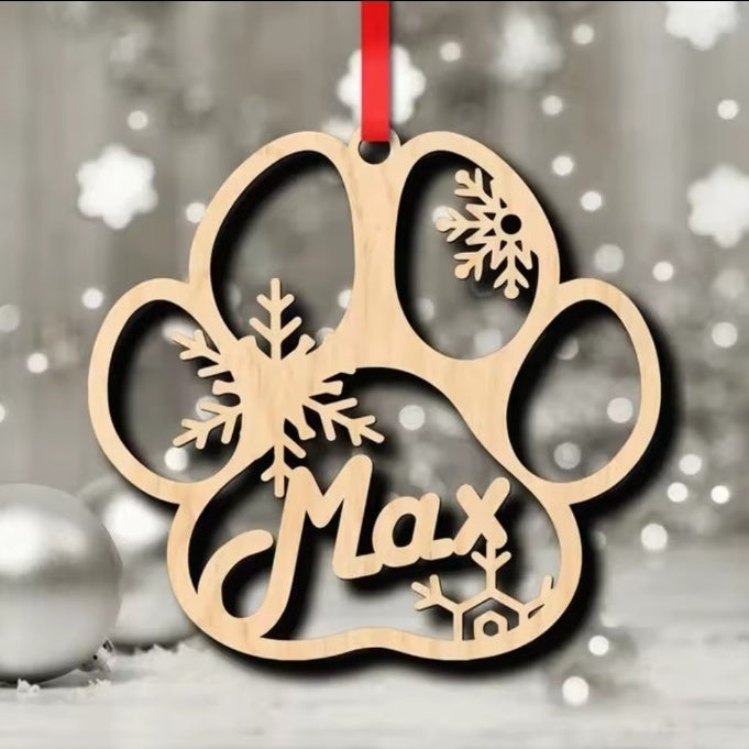 9 cm wooden personalised dog paw Christmas decoration showing snowflake cut-outs and sample name Max