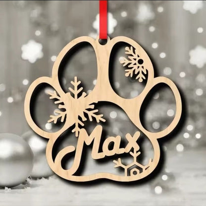 9 cm wooden personalised dog paw Christmas decoration showing snowflake cut-outs and sample name Max